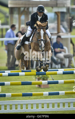 New Zealand's Andrew Nicholson on NEREO takes part in the Showjumping during day three of the Barbury International Horse Trials at Barbury Castle, Wiltshire. Stock Photo