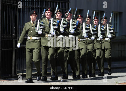 Soldiers from Cathal Bruagh Barracks in Dublin take in the first of a series of centenary military guard parades at the National Memorial to members of the Defence Forces who died in the service of the State at Merrion Square. Stock Photo