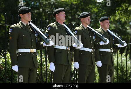 Soldiers from Cathal Bruagh Barracks in Dublin take in the first of a series of centenary military guard parades at the National Memorial to members of the Defence Forces who died in the service of the State at Merrion Square. Stock Photo