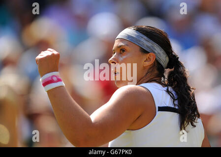 France's Marion Bartoli celebrates against Germany's Sabine Lisicki during day twelve of the Wimbledon Championships at The All England Lawn Tennis and Croquet Club, Wimbledon. Stock Photo