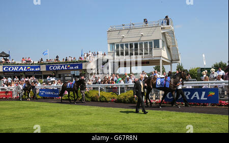 Horse Racing - Coral-Eclipse Day - Sandown Park. Horses are paraded before the Coral Distaff Stock Photo