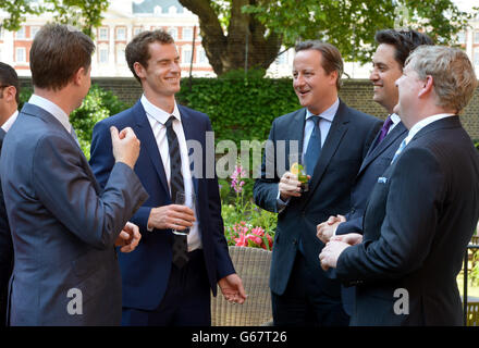 Wimbledon winner Andy Murray joins (from left) Deputy Prime Minister Nick Clegg, Prime Minister David Cameron, labor leader Ed Miliband and SNP Westminster leader Angus Robinson during a cross-party reception in the garden of Downing Street, London l Stock Photo