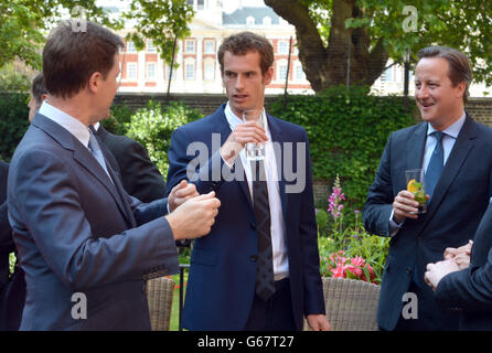 Wimbledon winner Andy Murray joins Deputy Prime Minister Nick Clegg and Prime Minister David Cameron, during a cross-party reception in the garden of Downing Street, London. Stock Photo