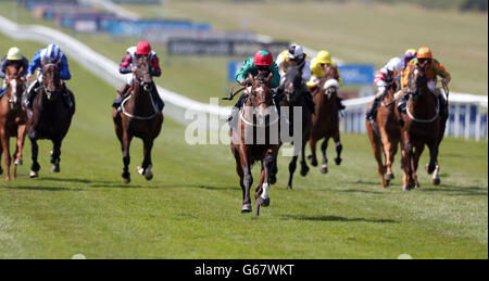 Maputo ridden by Graham Lee wins the Boylesports.com Download Our App Handicap Stakes during Boylesport Ladies Day of the Piper-Heidsieck July Festival at Newmarket Racecourse, Newmarket. Stock Photo