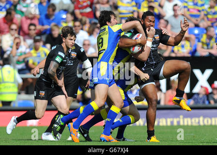 Huddersfield Giants Ukuma Ta'ai is tackled by Warrington Wolves' Stefan Ratchford, Trent Waterhouse and Simon Grix during the Tetley's Challenge Cup, Quarter Final at the Halliwell Jones Stadium, Warrington. Stock Photo