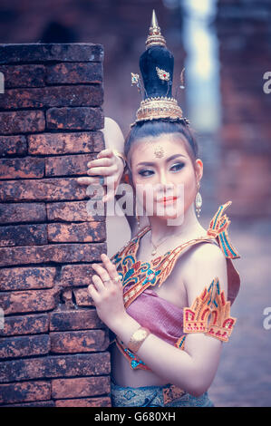 asai Woman In Thai traditional dress with old pagoda at Chiangsan Chiangrai Thailand Stock Photo