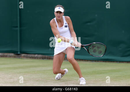 Switzerland's Belinda Bencic in action against Estonia's Anett Kontaveit during day nine of the Wimbledon Championships at The All England Lawn Tennis and Croquet Club, Wimbledon. Stock Photo