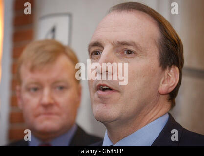 MP Simon Hughes (right) with the leader of the Liberal Democrat's Charles Kennedy, after being nominated as the Liberal Democrat candidate for the position of London Mayor at their party headquarters in London. Stock Photo