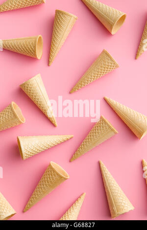 Sweet wafer cones on pink background. Stock Photo