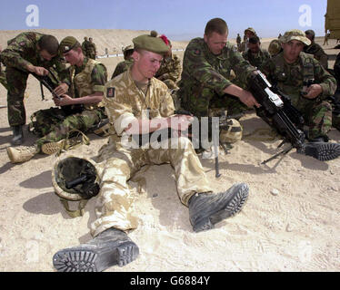 Private Stewart Adams, 21, from 1st Light Infantry Battalion assembles the latest issue MINIMI automatic machine gun, distributed to the British army. * The gun was issued to troops on the Kuwait-Iraq border from the 1st Light Infantry Battalion (2nd Royal Tank Regiment Battle Group) after undergoing rigorous testing by ballistic experts.