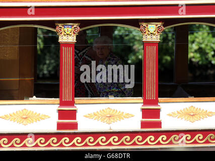 Queen Elizabeth II and The Countess of Wessex are rowed down the river Thames near Windsor in the royal barge the Gloriana. Stock Photo