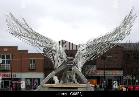 A sculpture labelled the 'Angel of the South' waits to be unveiled in a shopping centre in Islington, north London. The 52ft high model was designed by sculptor Wolfgang Butress, who won a competition to design the piece and will tower over the central park. Stock Photo