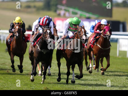 Heaven's Guest ridden by Ryan Moore (right) wins the Betfred 'The Bonus King Stakes during Abu Dhabi Gentlemen's Day of the Piper-Heidsieck July Festival at Newmarket Racecourse, Newmarket. Stock Photo