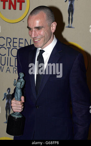 Actor Daniel Day-Lewis poses for photos with his Screen Actors Guild (SAG) awards at the 9th annual Screen Actors Guild Awards at the Shrine Auditorium in Los Angeles. Day Lewis won outstanding performance by a male actor in a leading role for his role in Gangs of New York. Stock Photo