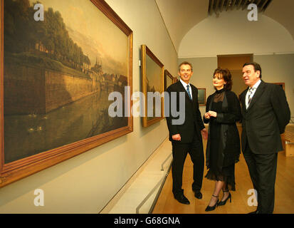 Britain's Prime Minister Tony Blair, left, along with his wife Cherie and Germany's Chancellor Gerhard Schroeder view works in the exhibition entitled 'Masterpieces from Dresden', at The Royal Academy of Art in London. * Herr Schroeder visited Mr Blair to discuss fresh United Nations resolutions on Iraq. Stock Photo