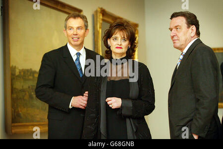 Britain's Prime Minister Tony Blair, left, along with his wife Cherie and Germany's Chancellor Gerhard Schroeder view works in the exhibition entitled 'Masterpieces from Dresden', at The Royal Academy of Art in London. * Herr Schroeder visited Mr Blair to discuss fresh United Nations resolutions on Iraq. Stock Photo