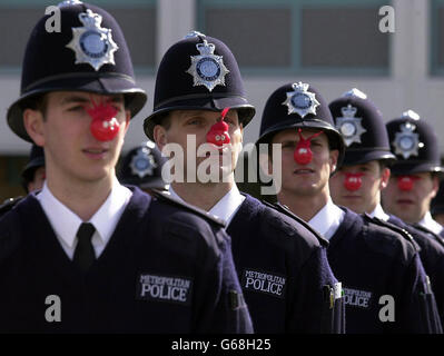 Police recruits wearing red noses in a rehearsal for their passing out parade on Friday March 14 2003 at Hendon Training School, North London. The new recruits have unertaken a range of activities to raise more than 7,000 for a local charity, North London Hospice. *..Charity events included a sponsered diet and a Cadbury's Creme Egg Eat-a-thon. Stock Photo