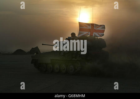 Image released British Forces in Kuwait, of the 'Scimitar' light armoured vehicles from the Queen's Dragoon Guards taking up final positions in the northern Kuwaiti desert. Stock Photo