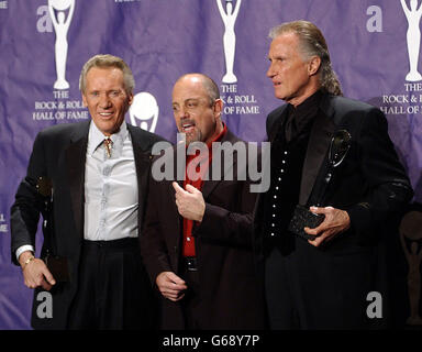 American singer Billy Joel flanked by with The Righteous Brothers Bill Medley (left) Bobby Hatfield after he inducted them into The Rock & Roll Hall of Fame in a cermony at the Waldorf Astoria in New York City, USA. Stock Photo