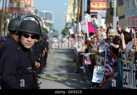 LA Police Department officers are guard during Anti-War Protest on Sunset Boulevard, near Kodak Theatre where 75th Academy Awards is helding, in Hollywood. Stock Photo