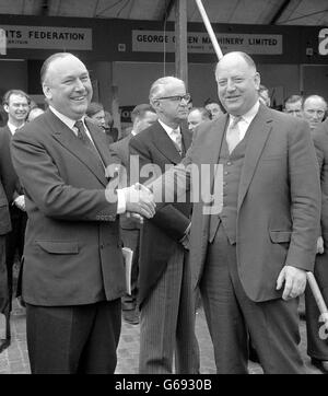 Dr Richard Beeching, (right) woh will soon be leaving his post as Chairman of the british Railways Board, has his hand shaken by Lord Robens, Chairman of the Natinla coal Board and thanked for his service to the railways at Marlybone, London. The occasion was the opening of the Second Coal Handling Exhibition. Stock Photo