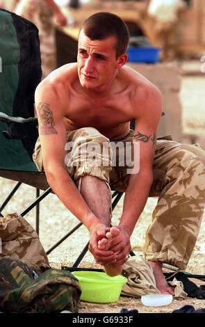 Scots Dragoon Guard - Iraq War. A Royal Scots Dragoon Guard takes a break after a long night of fighting in Southern Iraq. Stock Photo