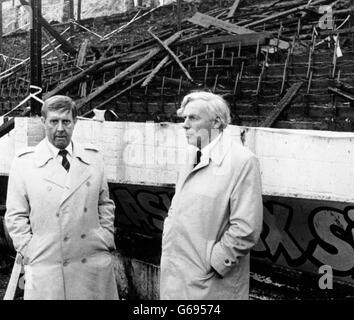 Bradford City FC chairman Stafford Heginbotham (left) with Mr Justice Popplewell, in front of the stand which was burnt at Bradford's Valley Parade ground. The 57-year old judge spent more than half-an-hour touring the ground. He is heading the inquiry into the blaze. Stock Photo