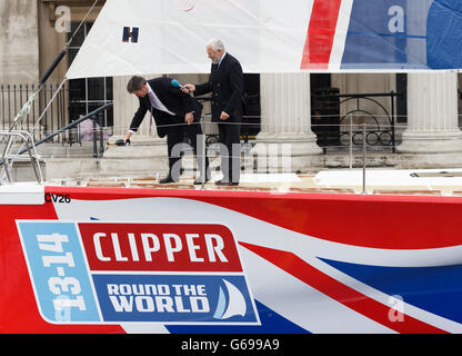 Sir Robin Knox-Johnston and Sport Minister Hugh Robertson (left) christen the yacht called Great Britain in Trafalgar Square, London. PRESS ASSOCIATION Photo. Picture date: Wednesday July 31, 2013. Photo credit should read: John Walton/PA Wire Stock Photo
