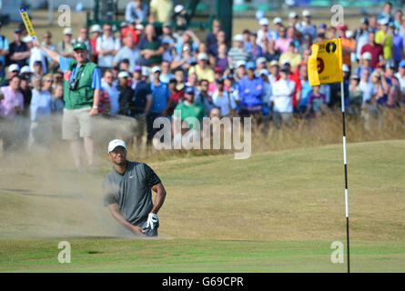 USA's Tiger Woods chips out of a bunker during day three of the 2013 Open Championship at Muirfield Golf Club, East Lothian. Stock Photo