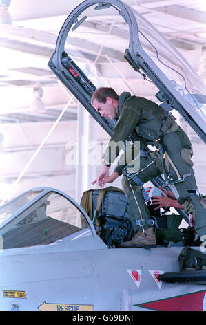 Wilcox of the RAF climbs into the cockpit of a British 'Tornado' fighter plane after UK forces arrived in Saudi Arabia. Stock Photo