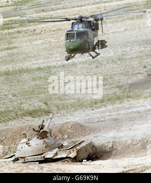 An Iraqi Army helicopter flies over the city of Baquba, the capital of ...