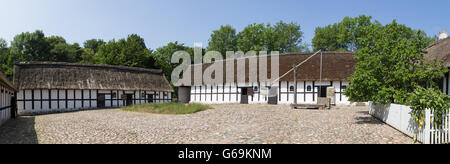 Lyngby, Denmark - June 23, 2016: Panoramic view of courtyard of an ancient danish farmhouse. Stock Photo