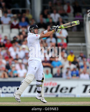 England batsman Kevin Pietersen hits a 4 to get his 100 during day three of the Third Investec Ashes test match at Old Trafford Cricket Ground, Manchester. Stock Photo
