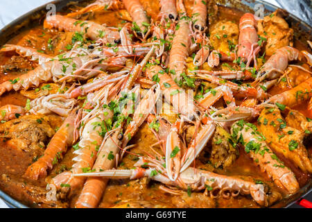 Paella with seafood and vegetables in a pan Stock Photo