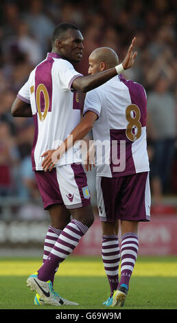 Aston Villa's Christian Benteke celebrates scoring his 3rd goal against Crewe Alexandra with team mate Karim El Ahmadi Stock Photo