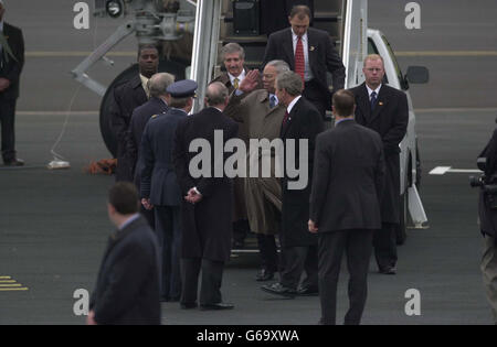 US President George W Bush and Secretary of State Colin Powell are greeted by Northern Ireland Secretary Paul Murphy (left behind officer in uniform) at RAF Aldergrove, in Northern Ireland. * The President continued by Black Hawk helicopter from the base to Hillsborough Castle, outside Belfast, for talks on the war in Iraq with British Prime Minister Tony Blair. Mr Bush was also expected to use the visit to urge politicians and paramilitaries in Northern Ireland to go the extra mile for peace. Stock Photo
