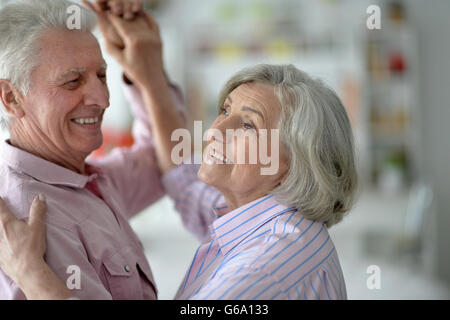 happy senior couple dancing at home Stock Photo