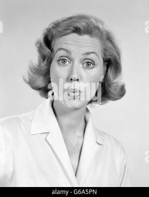 1950s 1960s PORTRAIT WOMAN WITH SHOCKED SURPRISED FACIAL EXPRESSION Stock Photo