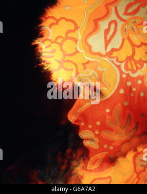 1960s PORTRAIT PROFILE YOUNG WOMAN WITH PSYCHEDELIC DESIGN PATTERN IMPOSED ONE FACE Stock Photo
