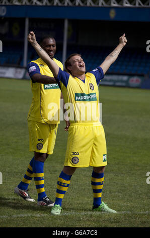 Farnborough FC player David Beckham, formally known as Scott Paul Donnelly (right), recreates the famous England v Greece goal celebration, at Cherrywood Road in Farnborough, during the launch of a new sponsorship deal with Paddy Power. Stock Photo