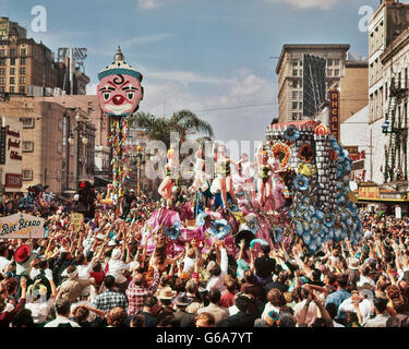 1960s MARDI GRAS REX PARADE ON CANAL STREET FEBRUARY 14 1961 CROWD REACHING FOR TRINKETS NEW ORLEANS LA USA Stock Photo