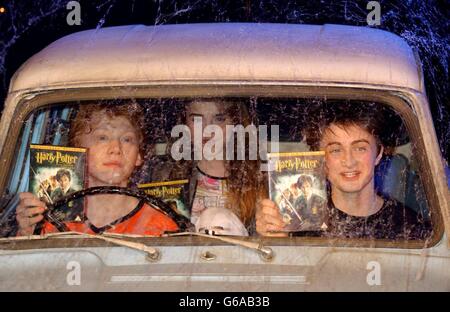 The stars of Harry Potter and the Chamber of Secrets, from left to right; Rupert Grint, Emma Watson and Daniel Radcliffe during the worldwide launch of the DVD/VHS at Leavesden Studios in north London. Stock Photo