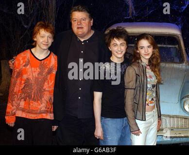The stars of Harry Potter and the Chamber of Secrets, from left to right; Rupert Grint, Robbie Coltrane, Daniel Radcliffe Emma Watson during the worldwide launch of the DVD/VHS at Leavesden Studios in north London. Stock Photo