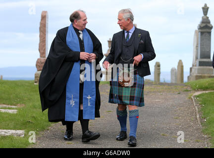 The Prince of Wales with minister Mr Lyall Rennie (left) attending a church service at Canisbay Church, Caithness. Stock Photo