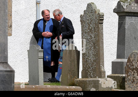 The Prince of Wales with minister Mr Lyall Rennie (left) at Canisbay Church, Caithness, where he attended a church service. Stock Photo