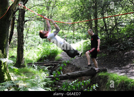 Lance Bombardier James Simpson of the Royal Artillery with head coach Michael Cohen during a training session in woods near Otley, Leeds, ahead of the Spartan Race he is competing in September. Stock Photo