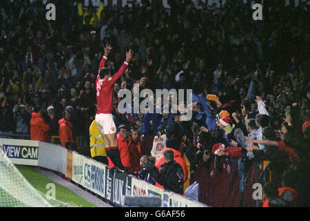 Soccer - FA Carling Premiership - Manchester United v Aston Villa - Old Trafford. Eric Cantona celebrates with the Old Trafford crowd after scoring his second goal for Manchester United against Aston Villa. Stock Photo