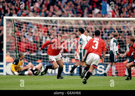 Manchester United's Eric Cantona celebrates scoring the winning goal Stock Photo