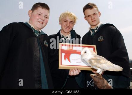 Three of the stars of the Harry Potter films, from right to left; Joshua Herdman (who plays Goyle), Tom Felton (Malfoy) and Jamie Waylett (Crabbe) during a photocall for the Safeway Excellence in England Awards 2003, *..in which the Harry Potter books and films were given the Outstanding Contribution to Tourism Award at Old Billingsgate Market in London. Stock Photo
