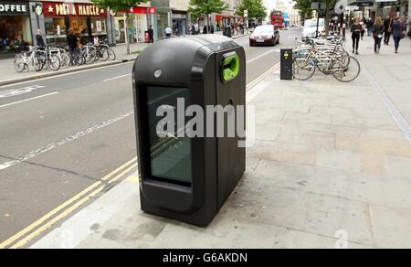 A rubbish bin equipped with television screens showing public ...